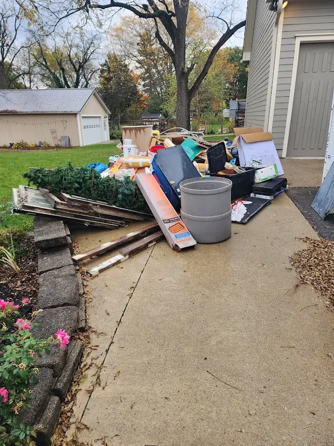 Dumpster being loaded with debris for Commercial Dumpster Rental in Carlisle